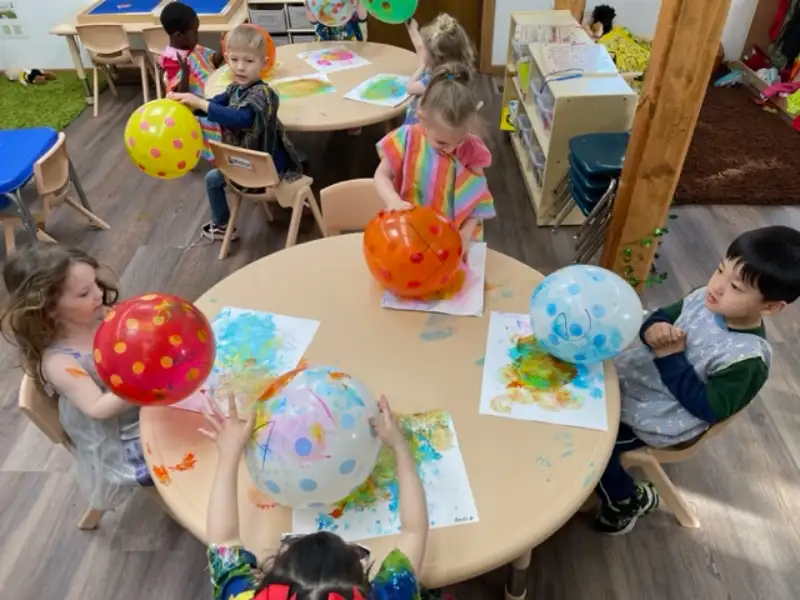 painting with balloons in preschool